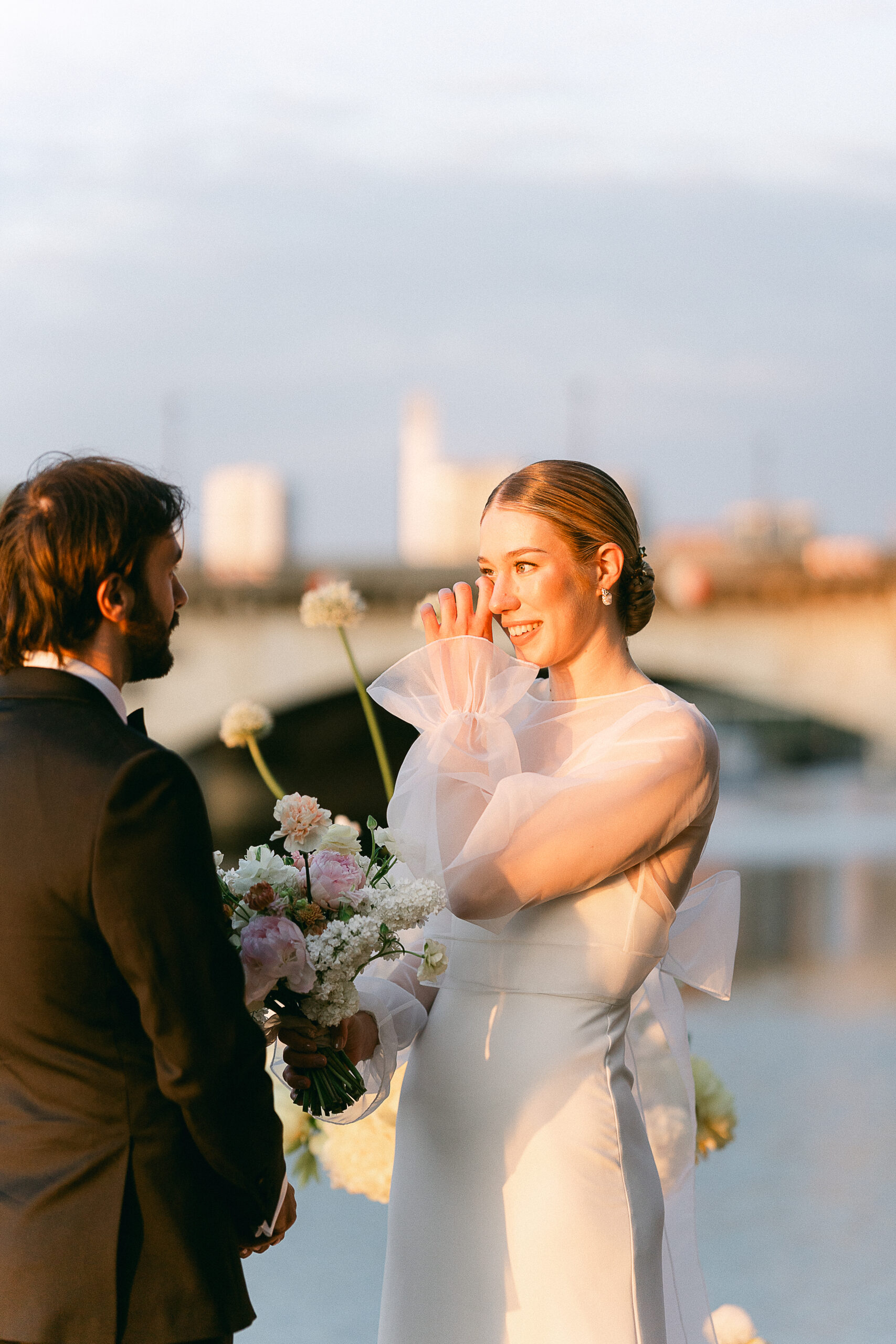 Bride crying during the exchange of vows in front of the Eiffel Tower