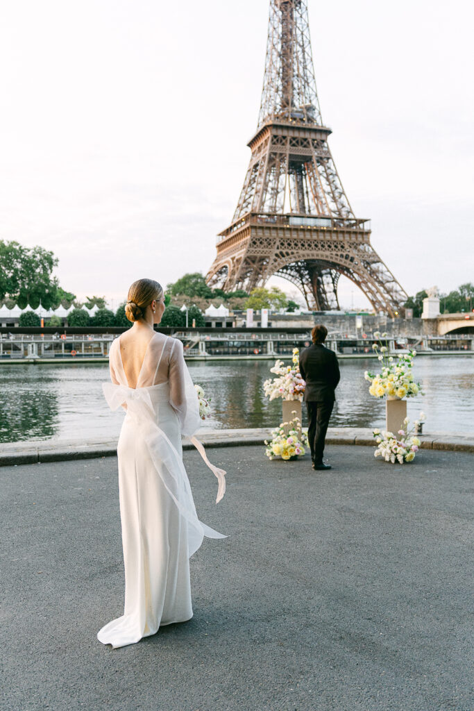 Loving couple exchanging vows at sunrise in front of the Eiffel Tower