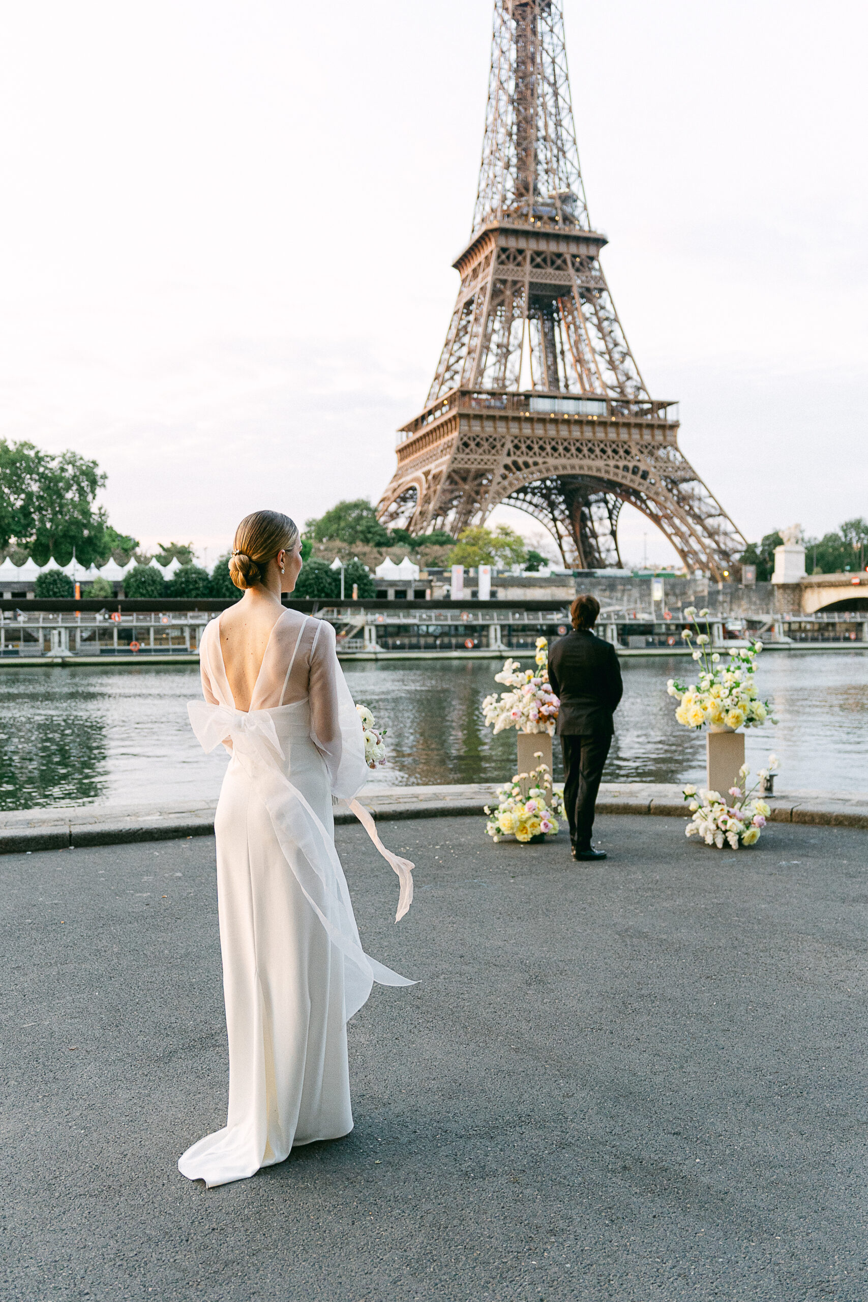 Loving couple exchanging vows at sunrise in front of the Eiffel Tower