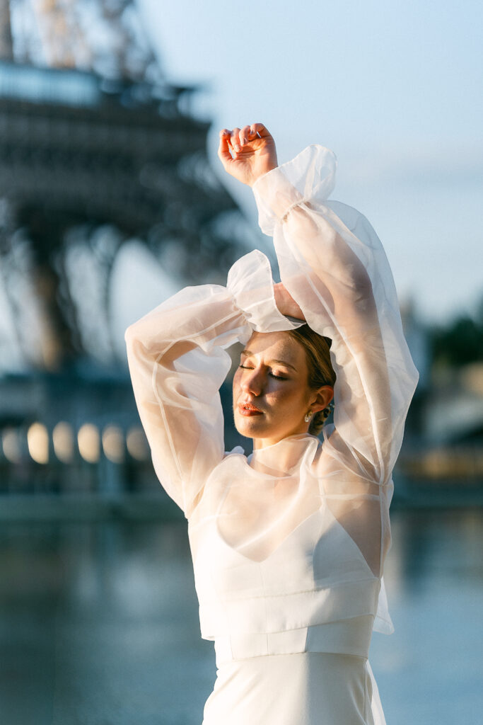 the bride posed elegantly on the banks of the Seine