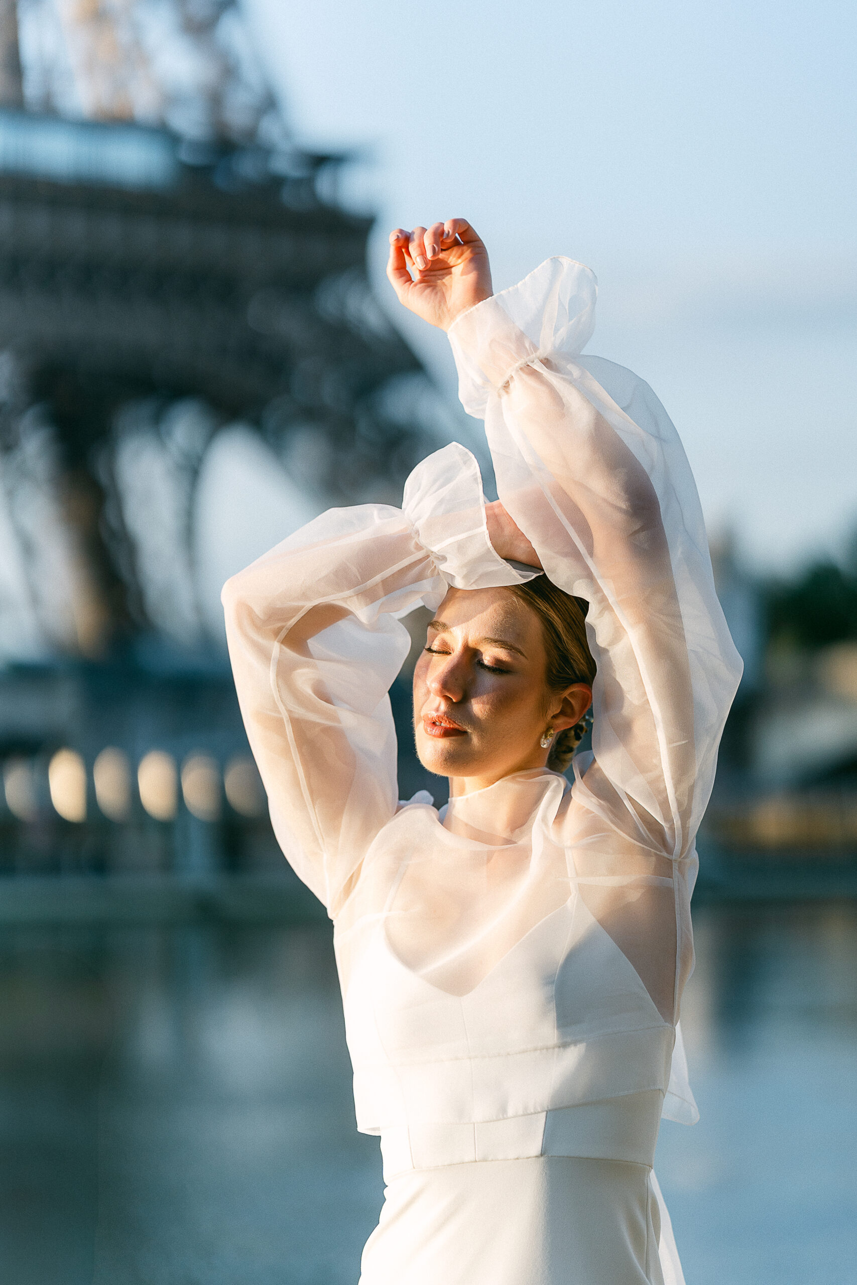 the bride posed elegantly on the banks of the Seine