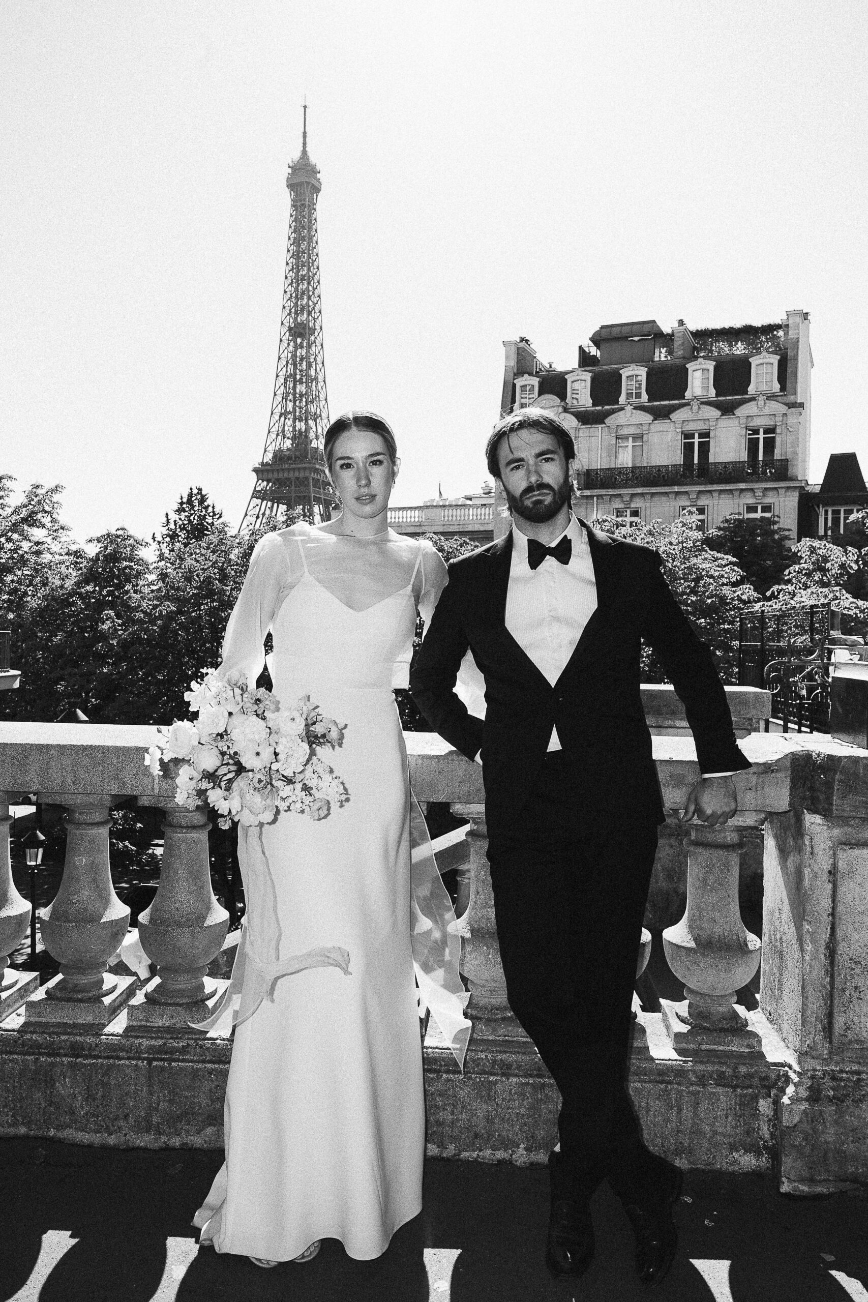 married couple poses in fashion on Camoens Avenue