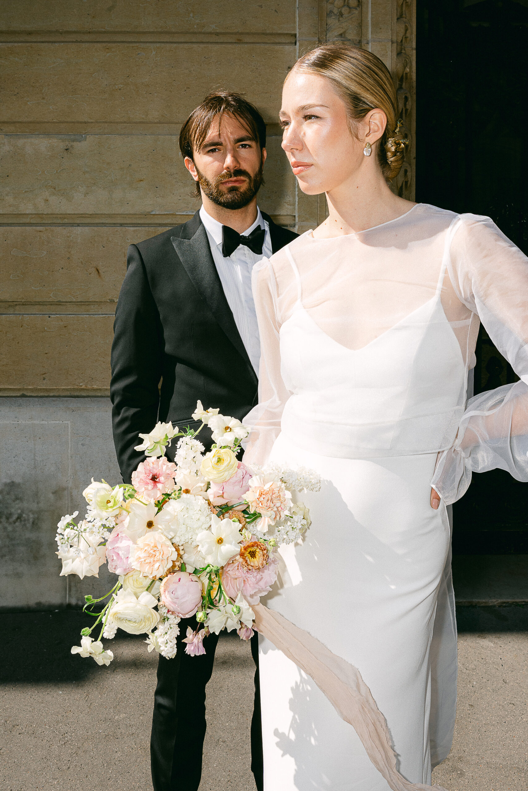 married couple poses in fashion on Camoens Avenue