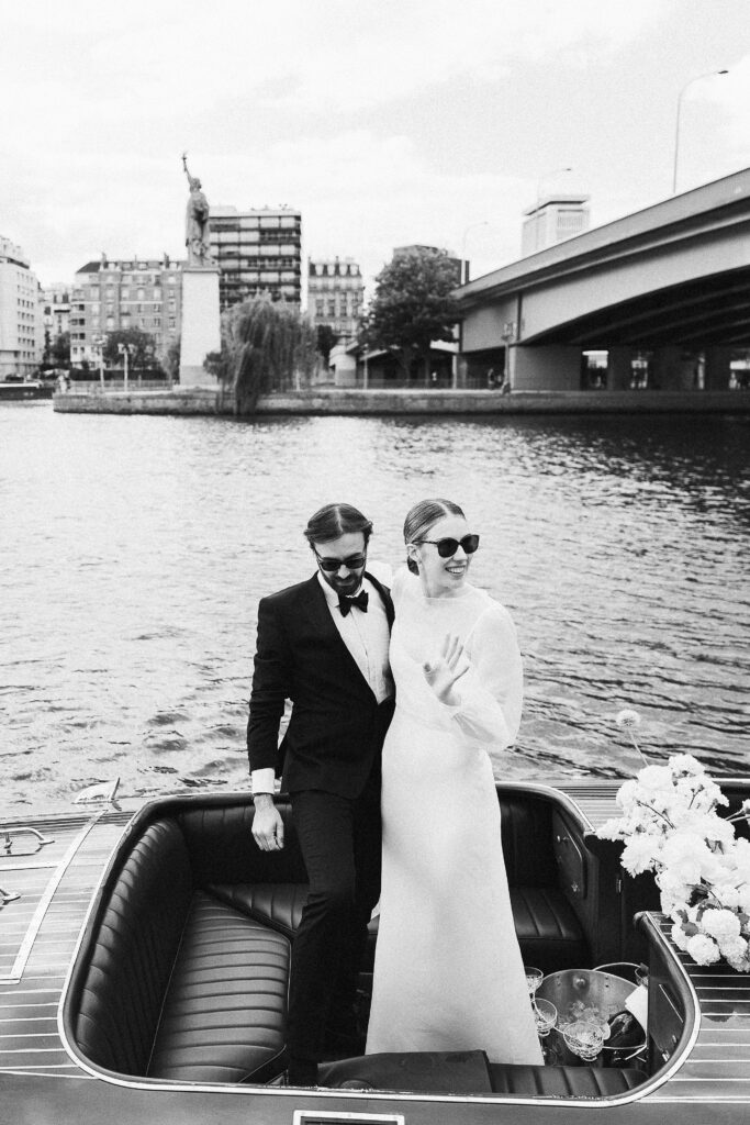 the bride and groom on a French Riviera-style boat on the Seine river in Paris