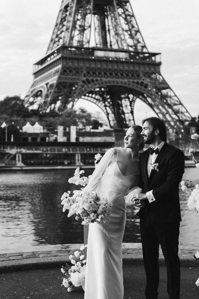 Loving couple exchanging vows at sunrise in front of the Eiffel Tower