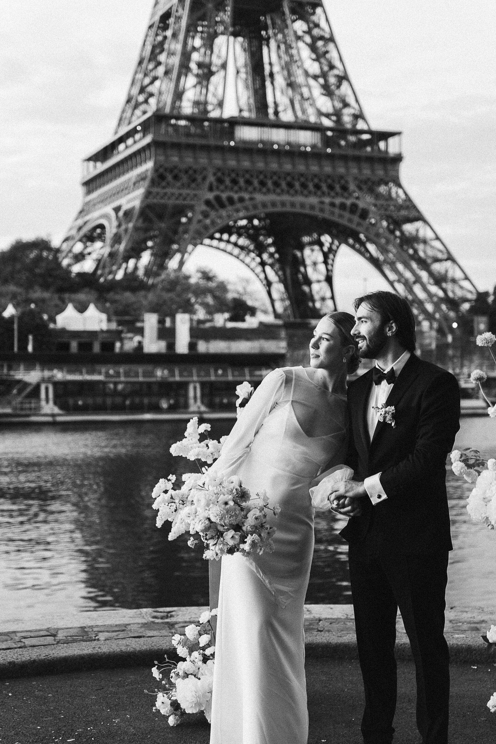 Loving couple exchanging vows at sunrise in front of the Eiffel Tower