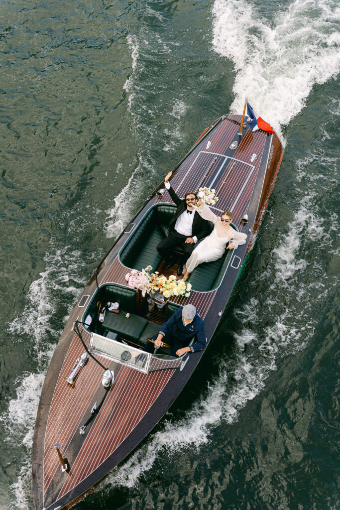 the bride and groom on a French Riviera-style boat on the Seine river in Paris